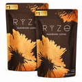 Two stand-up pouches of RYZE Mushroom Coffee overlapping on a plain white background. The pouches are dark brown with a large metallic gold leaf pattern and white branding text.